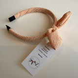 Gooiz | Haarband strik - ruit zalm/roze