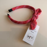 Gooiz | Haarband strik - streep roze/fuchsia